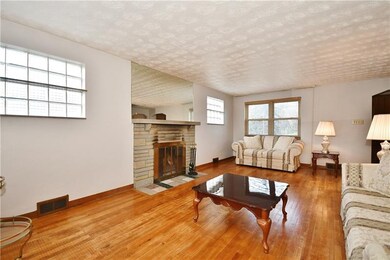 Super cozy den with wood burning fireplace