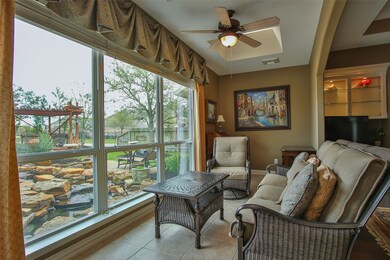 Texas Lanai.  Featuring Custom Drapes and Sky-Lights. These Large Windows look directly into Koi Pond and Lake.