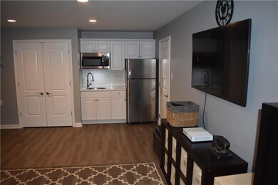 Lower level game room with kitchenette/wet bar.