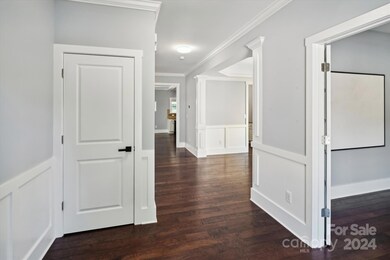 Entry area closet to left and offfice to the right