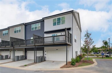 View of front of property with cooling unit
