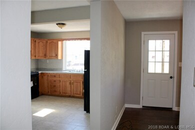 Hallway looking toward kitchen and living room (front door)