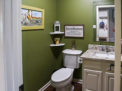 This half bath is located downstairs for guest. Al