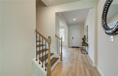 Entrance foyer featuring baseboards, ornamental mo