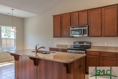 Upgraded kitchen with granite countertops, stainle