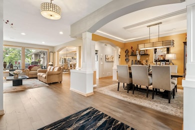 The foyer opens up to the open view of the formal dining room which flows into the formal living room plus extends to the other living areas of the main level.