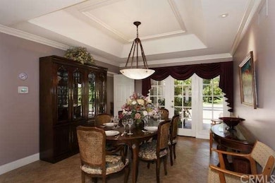 Formal dining room with coffered ceilings, French 