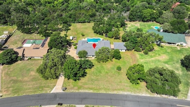 Aerial view of property and surrounding area with