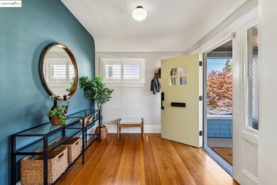 Entrance foyer with light wood-style flooring and baseboards