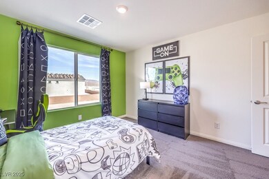 Carpeted bedroom featuring baseboards