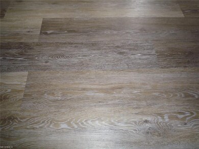New flooring throughout the house. Living and dini