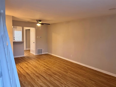 Unfurnished room with baseboards, visible vents, w
