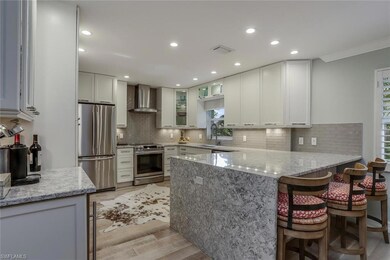 The kitchen has a double wide island wrapped in a 