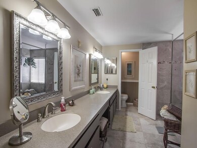 Master Bath with dual sinks and solid surface coun