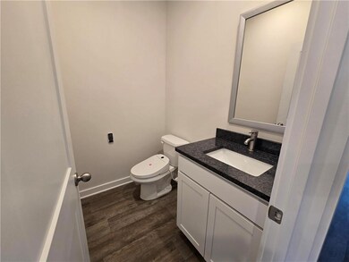 Half bathroom with granite tops