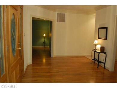Foyer - A welcoming hardwood foyer with 5 views:  
