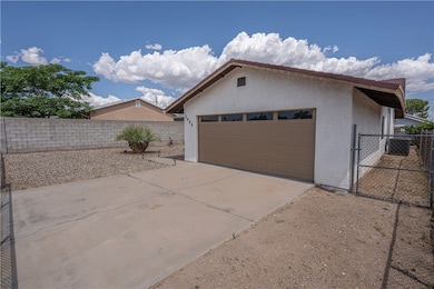 Garage with driveway and a gate