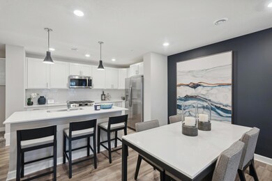 (Photo of a decorated model, actual homes finishes will vary) Enjoy a meal at the dining room table!