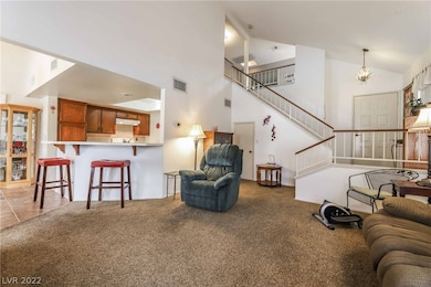 Great room features 17' ceilings, wood-burning fir