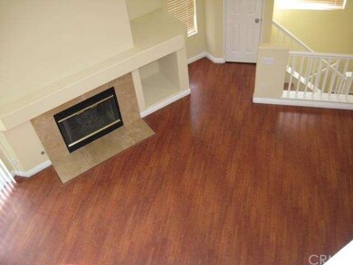 Open living room with laminate flooring.
