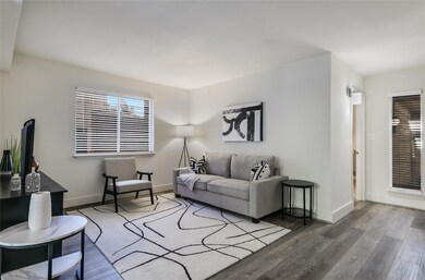 Living room with wood finished floors and plenty 
