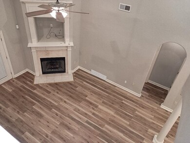 Unfurnished living room featuring a tile fireplace