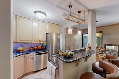 Kitchen featuring granite countertops, stainless a