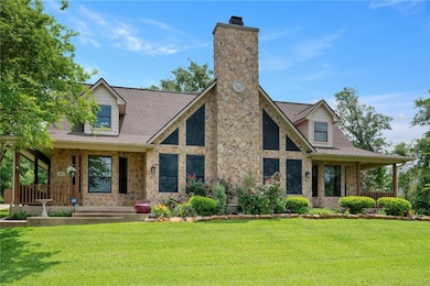 View of front of property with stone siding, a chi