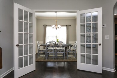 French doors lead to the formal dining room