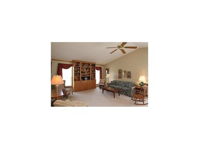 Great Room. Oak entertainment center w/windows on 
