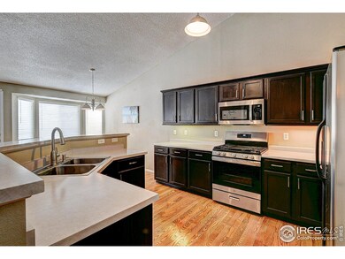 Large kitchen with wood floors