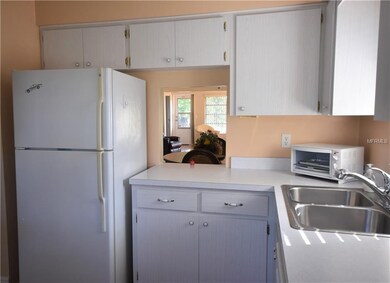 Kitchen with pass thru to dining area