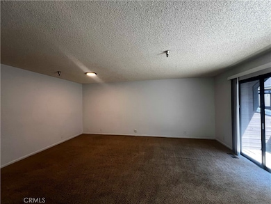 Large living room with slider out to the balcony.