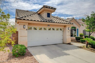 Mediterranean / spanish-style home featuring a til