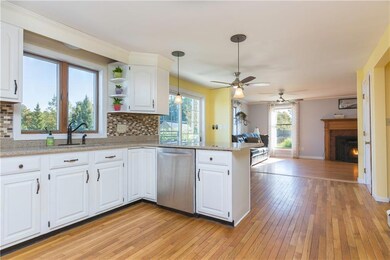 Bright kitchen with quartz counter,...