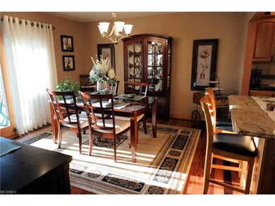 Dining room with hardwood floors and glass sliding
