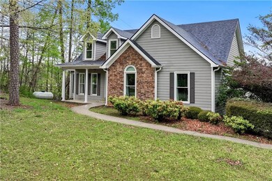 Craftsman inspired home with a front lawn, roof wi