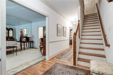 Elegant formal foyer with 9' ceilings throughout t