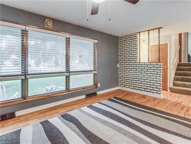 Enter into the foyer, which opens to a hardwood li