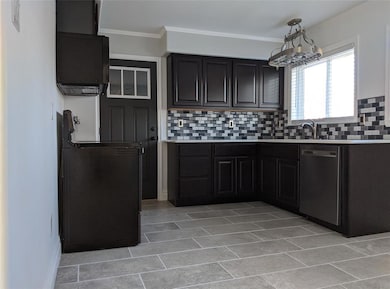 Beautiful neutral ceramic tile floors in eat-in ki