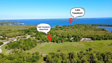 Aerial view with a water view and a forest view