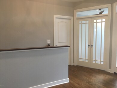 WW-03-061 Lily_ Foyer_ half wall stairwa