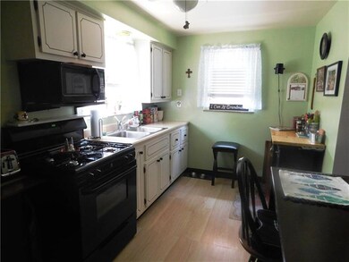 The eat-in-kitchen with new flooring. All of the a