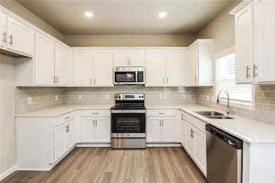 Kitchen with a sink, appliances with stainless ste