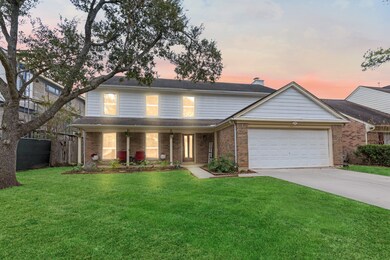 Relax and unwind on the inviting front porch, taki