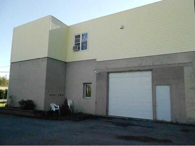 Other West ide of apartment with overhead door to 