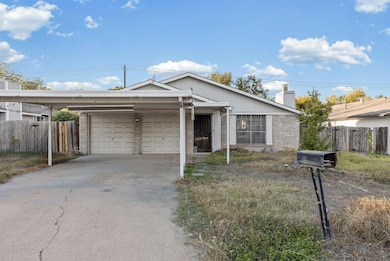 Ranch-style house with a chimney, brick siding, and driveway and yard. Nice level lot with no slopes. Photo taken during the fall/winter. House For Sale: 6300 Libyan Dr., Austin, Tx 78745. Travis County.