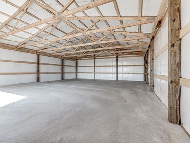 Inside of 30' x 40' shop w/ concrete floors, an ov