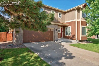 View of front of home featuring driveway, board and batten siding, and an attached garage