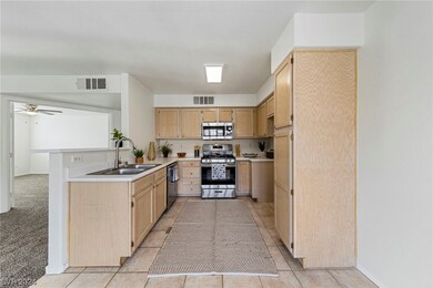 KITCHEN WITH STAINLESS SINK AND APPLIANCES